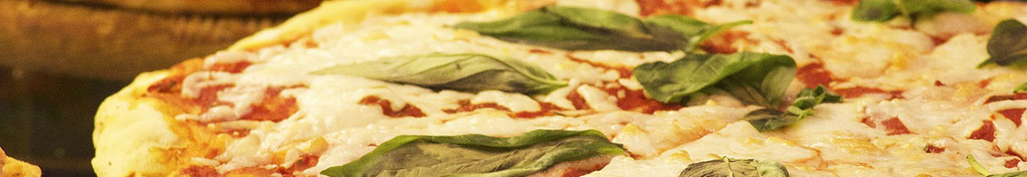 Eating Italian Pizza at Adrienne's Pizzabar restaurant in New York, NY.
